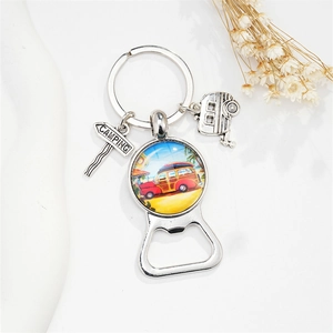 Detail of vintage camper keychain bottle opener with camping road sign on white background