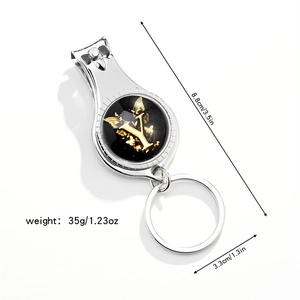 Close-up of 3-in-1 metal keychain featuring a nail clipper, bottle opener, and butterfly Y design