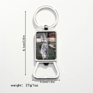 Detailed view of metal bottle opener keychain with cat and tiger art and size dimensions