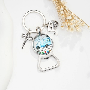 Detail view of silver camping keychain bottle opener with happy camper glass pendant and charms