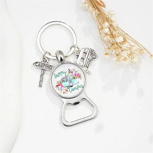 Detail of silver camping keychain with bottle opener and Happy Camper glass charm