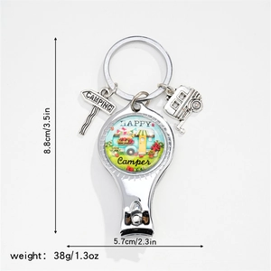 Multi-function silver nail clipper keychain with Happy Camper charm and road sign detail
