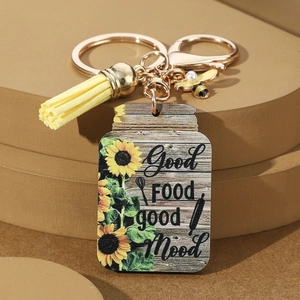 Wooden sunflower keychain with yellow tassel and bee charm featuring Good Food Good Mood text
