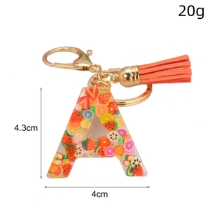 Porte-clés lettre A en résine avec tranches de fruits, pompon orange et fermoir doré