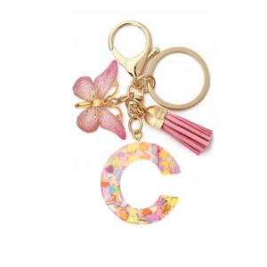 Pink resin letter C keychain with glitter hearts, butterfly pendant and pink tassel