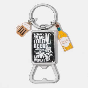 Close-up of a silver beer bottle opener keychain with colorful enamel charms and engraving