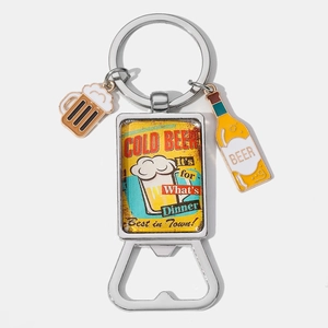 Close-up of portable metal beer opener keychain with retro enamel beer bottle charms