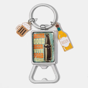 Macro detail of portable beer bottle opener keychain with vintage graphics and charms