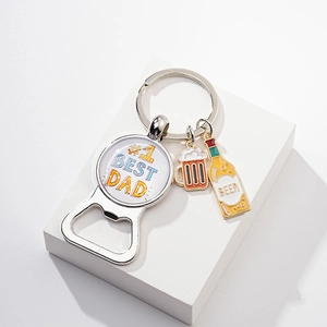 Detail of #1 Best Dad bottle opener keychain with beer charms on stone display