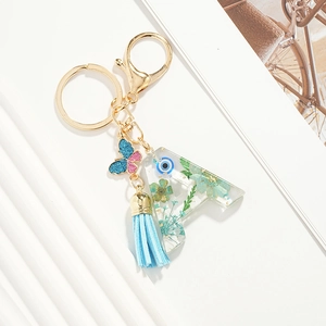 Pink heart sequin resin letter A keychain with blue dried flowers and evil eye charm