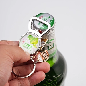 Detail of hand using the beer bottle opener keychain with I Love You Dad engraving