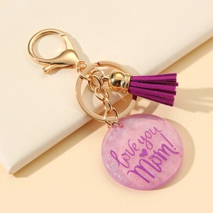 Porte-clés doré avec pompon violet et pendentif pailleté rose pour maman