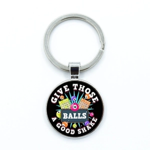 Detailed macro view of vintage zinc alloy bingo keychain with polished glass pendant art