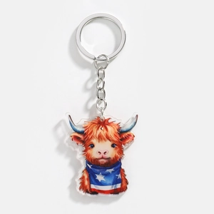 Macro detail of acrylic highland cow keychain with American flag scarf for festive decor