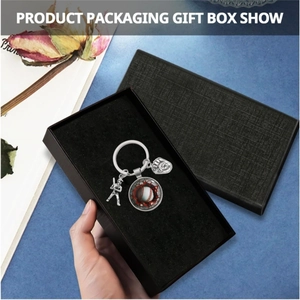 Baseball themed metal keychain with player and glove charms in a black gift box