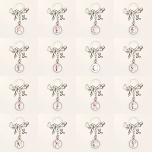Nurse appreciation keychain set with 16 floral letter pendants and medical charms