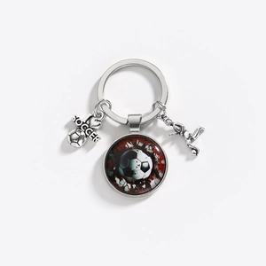 Detailed view of the soccer theme keychain with glass pendant and silver alloy charms