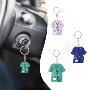 Detail view of 2D acrylic nurse uniform keychains in pink, blue and green with alloy rings