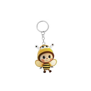 Close-up of cute cartoon bee acrylic keychain featuring a 3D child figure and metal ring