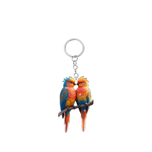 Detailed close-up of vibrant acrylic parrot keychain with durable silver metal ring