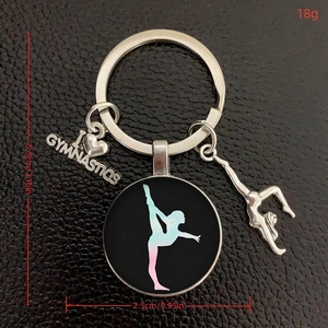 Gymnastics theme glass keychain with colorful athlete silhouette and silver charms