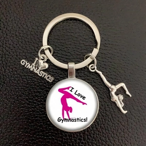 Detail of silver gymnastics keychain with I Love Gymnastics charm and silhouette pendant
