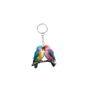 Close-up of vibrant acrylic parrot keychain with silver metal ring and durable link chain