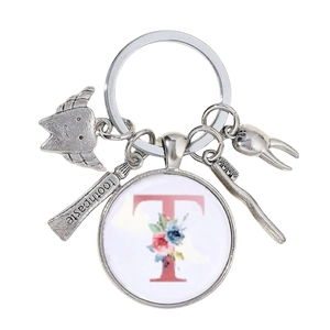 Détails du porte-clés dentaire argenté avec pendentifs dent et lettre T décorative