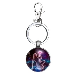 Macro view of the Virgo zodiac sign glass dome pendant on a silver metal keychain