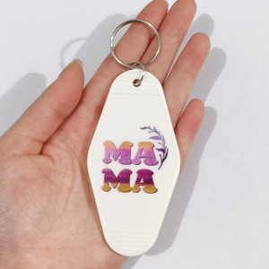 Vintage hotel-style MOM keychain in white acrylic with purple glitter MAMA lettering