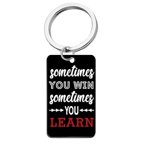 Black rectangle keychain with Sometimes You Win Sometimes You Learn inspirational quote