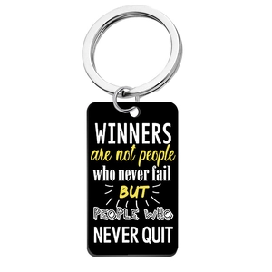 Detailed view of acrylic keychain with Winners Never Quit quote on black finish