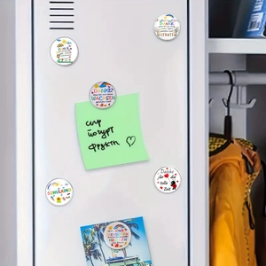 Close-up of 25mm glass round fridge magnets with colorful patterns on a metal surface