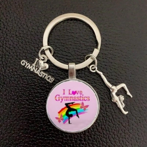 Detail of silver gymnastics keychain with I Love Gymnastics glass pendant and silhouette