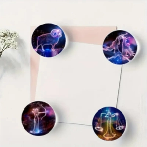 Detailed close-up of 25mm glass zodiac fridge magnets with purple galaxy constellation patterns