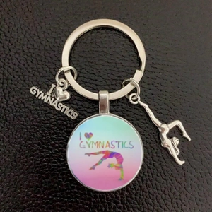 Detailed view of silver gymnastics keychain with colorful I Heart Gymnastics glass charm