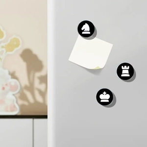 25mm round glass chess magnets holding a note on a white refrigerator surface