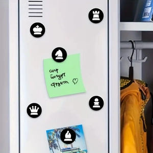 Detailed view of chess glass fridge magnets on a white metal cabinet for home decor