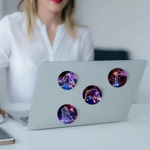 Set of zodiac glass magnets used as decorative laptop stickers with colorful nebula designs