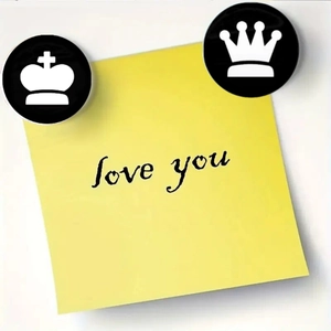Detail view of 25mm glass chess fridge magnets with king and queen crown designs