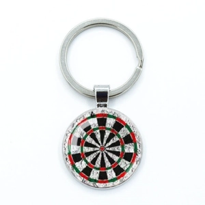 Macro shot of silver metal keyring featuring a detailed round dartboard target pendant