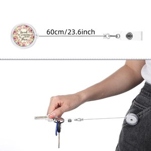 Detail of retractable badge holder with floral design and 60cm extension cord