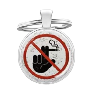 Macro shot of metal keychain pendant featuring a humorous no smoking sign design