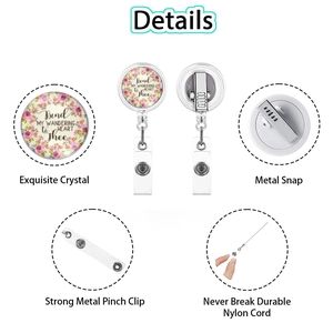 Detail view of floral badge reel showing the retractable nylon cord and steel back clip