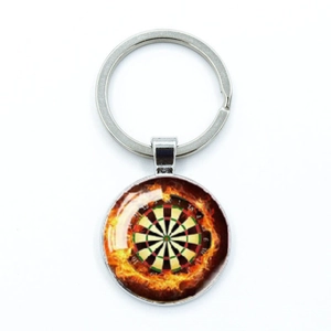 Close-up of dartboard keychain with flame effect under glass dome on metal ring