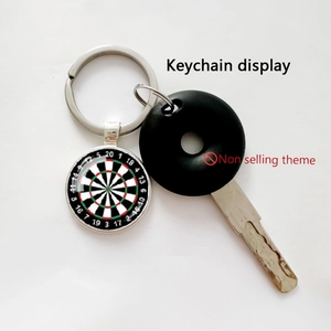 Detailed close-up of dartboard keychain with silver metal lobster clasp and glass pendant