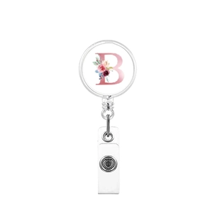 Retractable badge reel with a floral letter B design and a white plastic ID strap