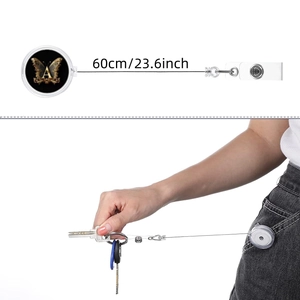 Retractable badge reel with butterfly design and letter A showing 60cm extension length