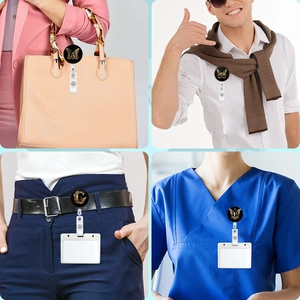 Retractable badge reel with letter print used on medical scrubs and casual belts