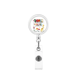 Detail of retractable badge holder with German text and colorful giraffe illustration